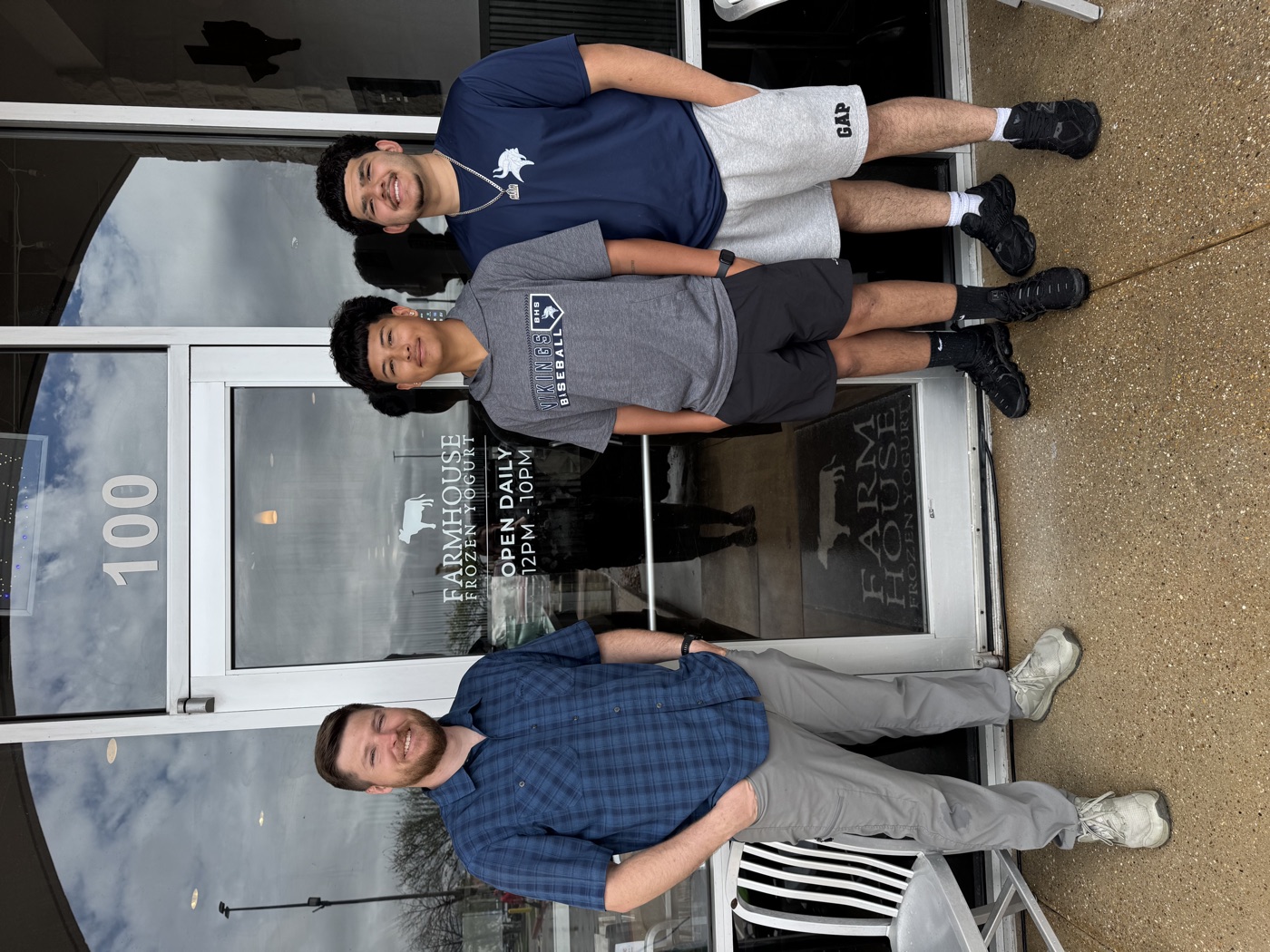 Ethan Castleberry with the two young men outside Farmhouse Frozen Yogurt